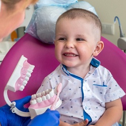 toddler with dental hygienist