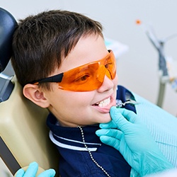 Dentist looking at child's smile