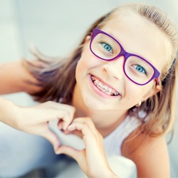 young girl with braces