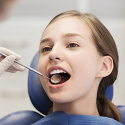 Girl receiving dental exam