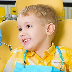Smiling little boy in dental chair