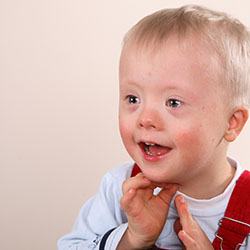 Little boy sitting and smiling after special needs dentistry in Casper, WY