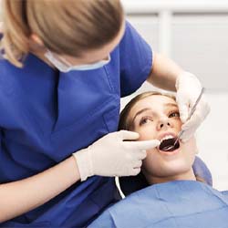 Teen receiving dental checkup in Casper