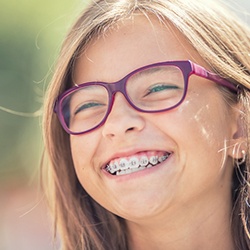 a child smiling with traditional braces in Casper