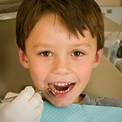 Young boy receiving dental exam