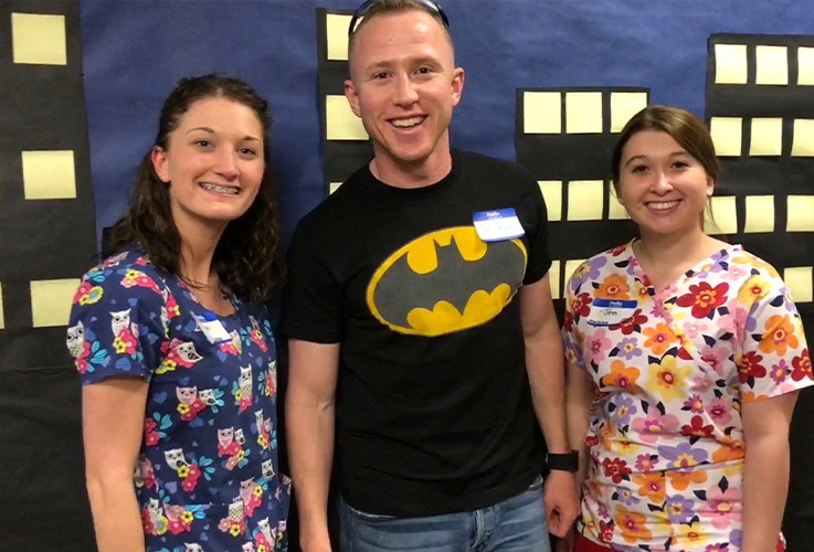 Doctor Paulson and two dental team members at community event