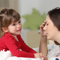 Crying child and worried parent