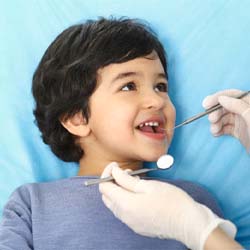 Little boy visiting his Casper pediatric dentist for checkup