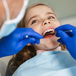 Dentist applying fluoride in Casper