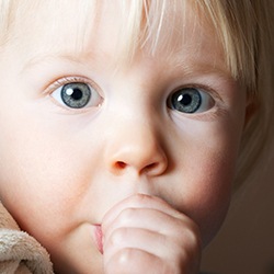 Young child sucking thumb