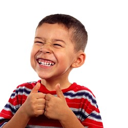 child smiling after having a good experience with a children’s dentist in Casper