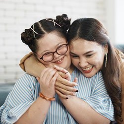 Little girl and mother hugging after special needs dentistry in Casper, WY