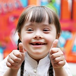 Little girl giving thumbs up after special needs dentistry in Casper, WY