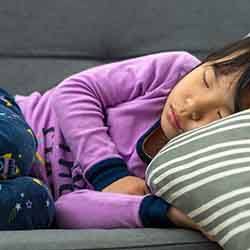 Little girl resting on the couch