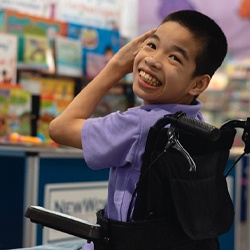 A young boy in a wheelchair preparing to visit a kid’s dentist in Casper for a regular checkup