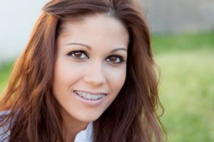 a young girl wearing braces