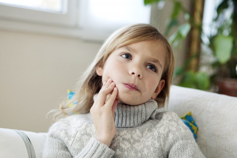 Child experiencing a toothache