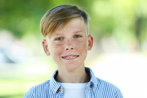 little boy wearing braces