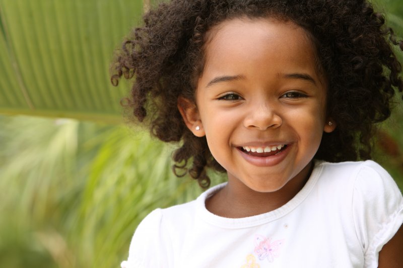 girl smiling after a frenectomy in Casper