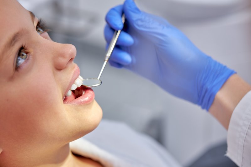 female undergoing dental checkup
