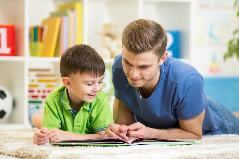 father reading to his son