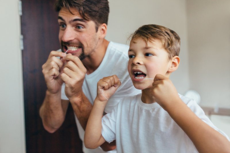 Portrait of a family flossing