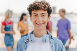 Young boy smiling with braces